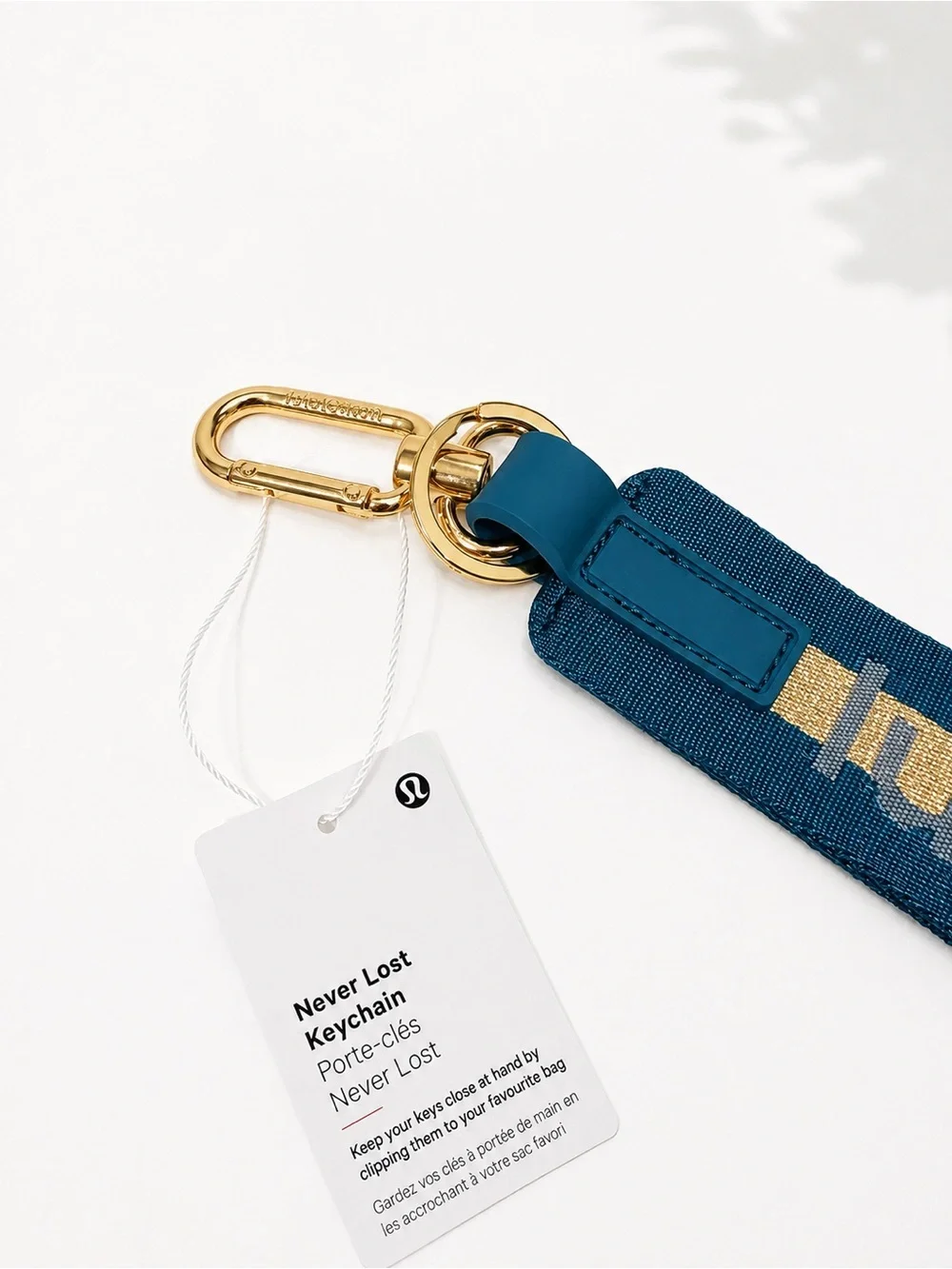 lululemon athletica Teal and Gold Never Lost Keychain Wristlet